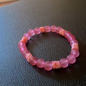 pink bracelet with regular beads and clay beads